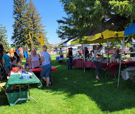 People attending a farmers market.