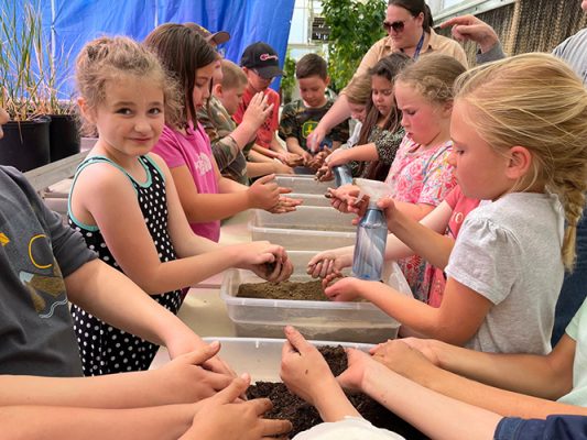 Henry-Coffeen-Garden-2-500h Students planting seeds