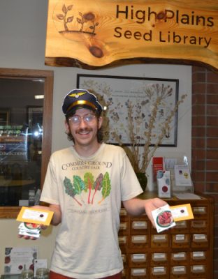 Man holding seeds at the High Plains Seed Library.
