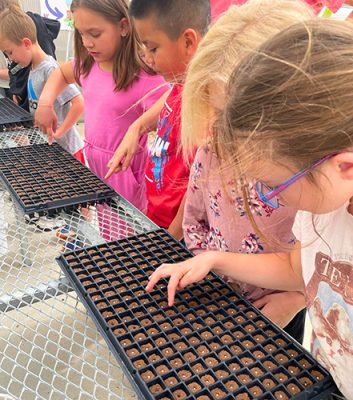 Highland-Park-Garden-2-500h Children planting seeds