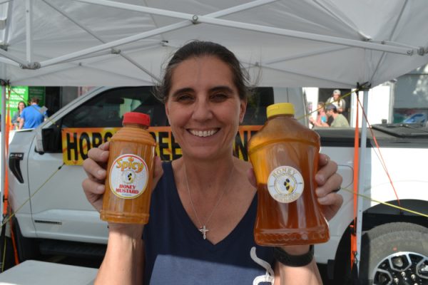 Horse Creek Honey co-owner Lara Taylor displays homemade spicy honey mustard and locally produced honey, which is available at the Downtown Laramie Farmers Market and The Butcher Block in Laramie.