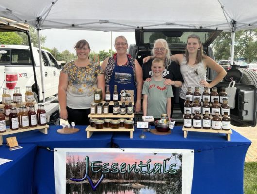 JVEssentials crew behind table with canned goods.