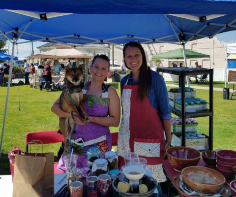 Ladies under tent at farmers market