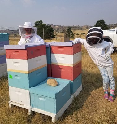 Kids with bee boxes