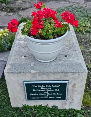 Monument with red geraniums.