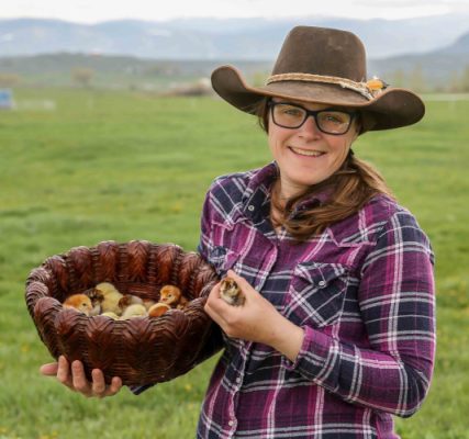 Melissa Hemken holding baby chickens.