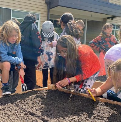 Students working in a garden