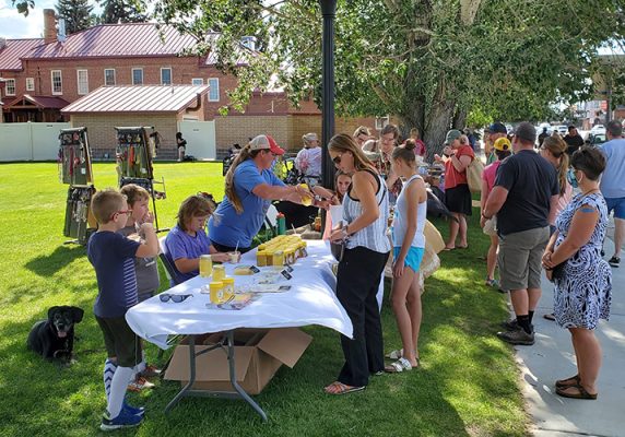 People buying produce at a Farmers Market