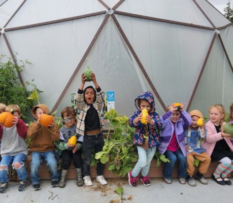 Children in a hoop house.