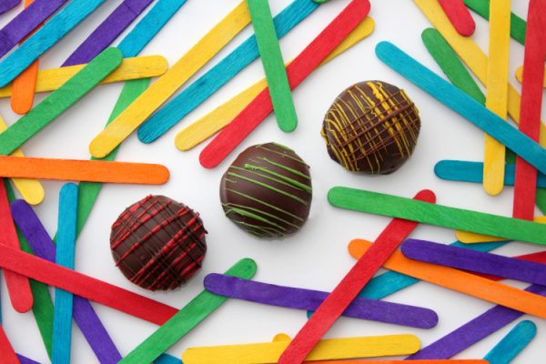 Chocolate truffles with colored popsicle sticks