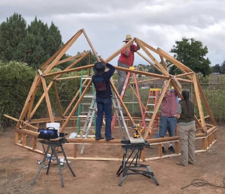 People building a hoop house