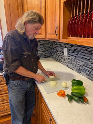 Man chopping vegetables