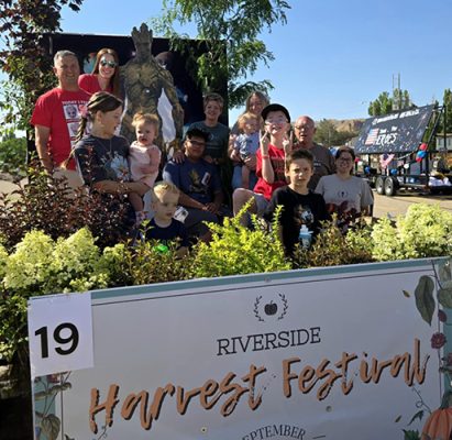 People and plants on a float