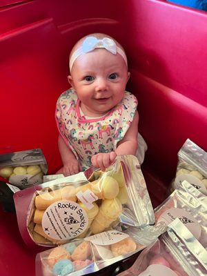 Baby girl with rocket snacks