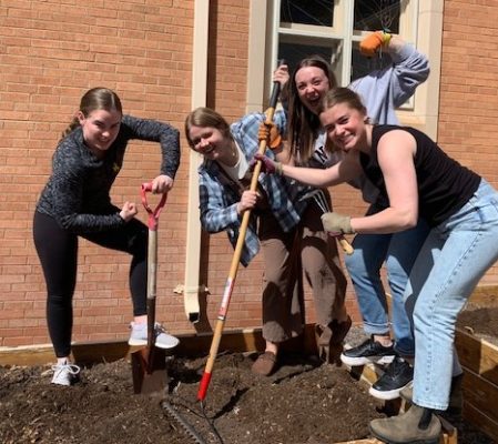Students working in a garden