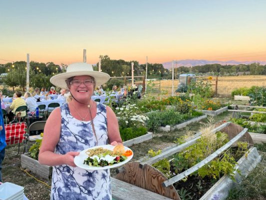 Woman in garden with plate