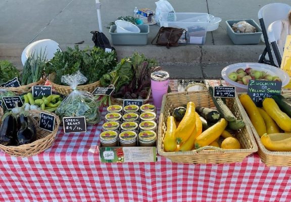 Fresh produce and canned goods on a table.