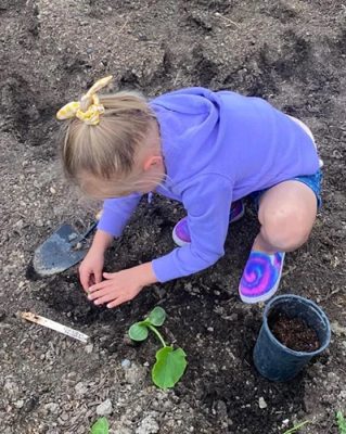 Child planting plants