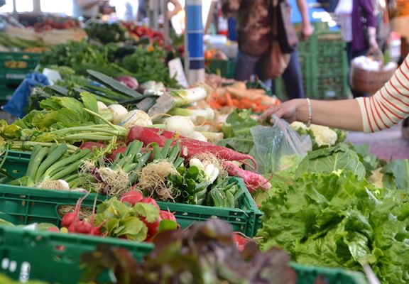 Hand selecting fresh produce