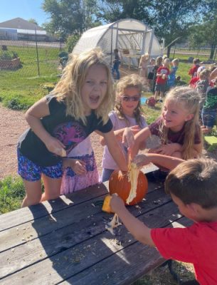 Kids sitting at a picnic table