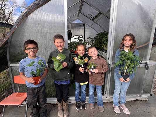 Children holding plants