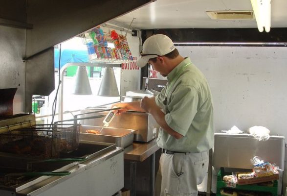 WDA_Consumer-Health-Services-465h Person testing temperature in a kitchen.