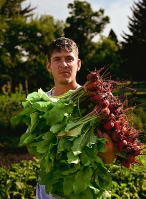 Man holding beets