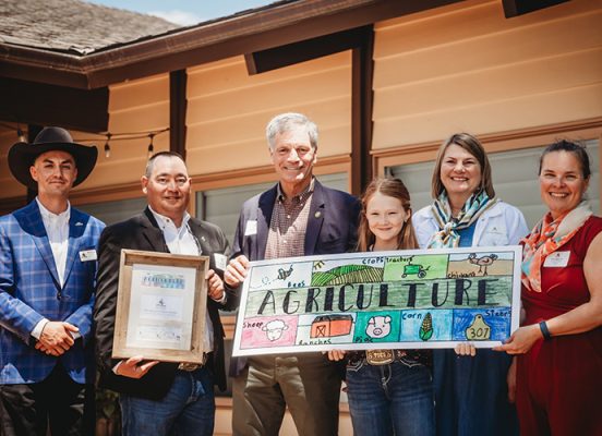 Wyoming-Agriculture-in-the-Classroom-1-500h Group holding winning design for the Bookmark & Beyond Contest.
